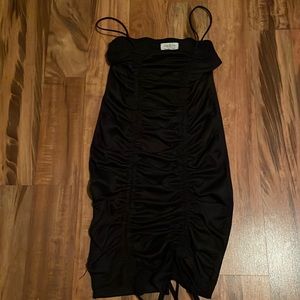 A black dress that fits pretty tight, women’s S, from Jolie & Joy.